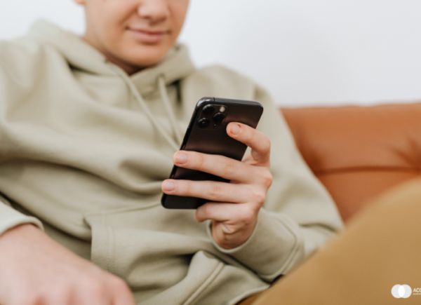 boy looking on mobile phone